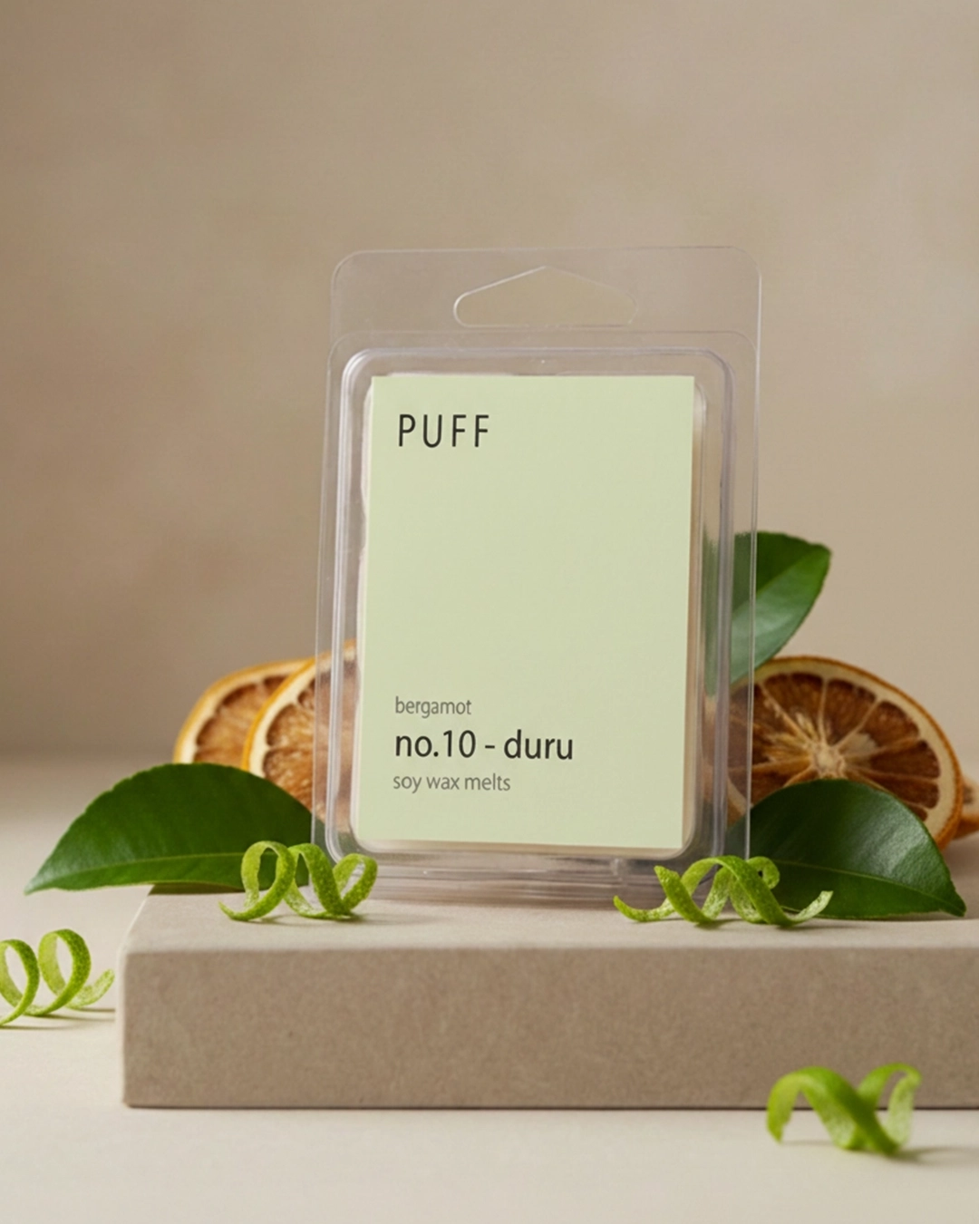 PUFF No.10 Duru – Bergamot Kokulu Buhurdanlık Mumu PUFF No.10 Duru bergamot kokulu soya wax melts, bergamot dilimleri ve doğal dekor ile ürün görseli